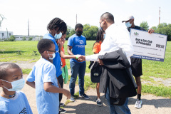 August 25, 2021: Sen. Sharif Street presents a check  to the Shane Victorino Nicetown Boys and Girls Club to rehab a field adjacent to the club to provide safe outdoor recreation for its members.  The club was renamed after the former Phillies centerfielder’s foundation committed $1 million to rehab the indoor facility a decade ago.