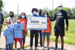 August 25, 2021: Sen. Sharif Street presents a check  to the Shane Victorino Nicetown Boys and Girls Club to rehab a field adjacent to the club to provide safe outdoor recreation for its members.  The club was renamed after the former Phillies centerfielder’s foundation committed $1 million to rehab the indoor facility a decade ago.